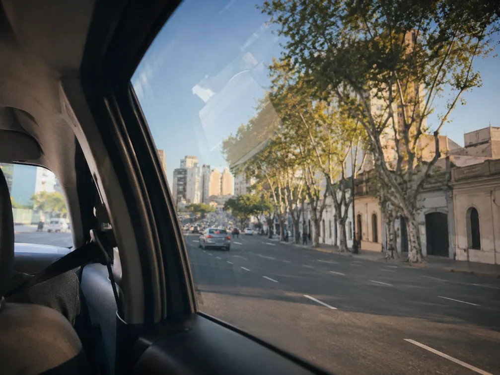 The view from a car window of a tree-lined Buenos Aires avenue on the ride in from the airport