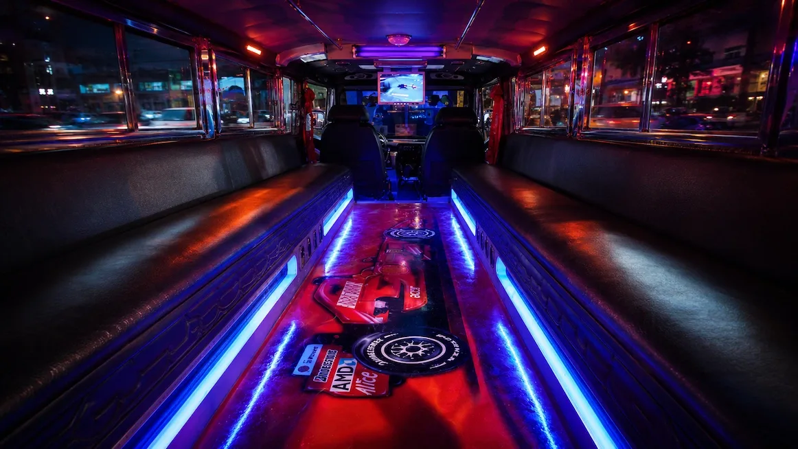 Inside a jeepney lit with LED strips at night