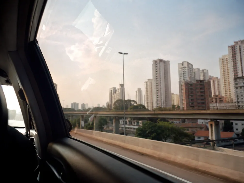 The view from a car window of the Manila skyline on the elevated road in from the airport