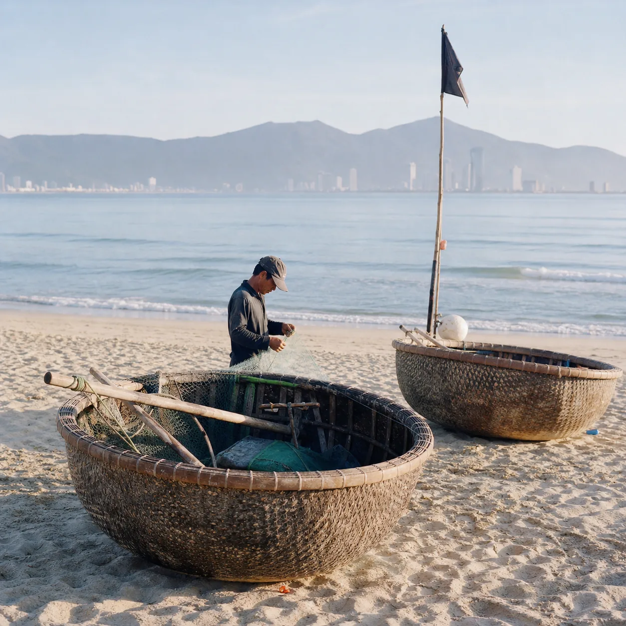 Early-morning light on My Khê beach in Da Nang, with fishing boats pulled up on the sand