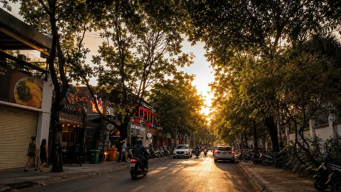 Golden hour on a tree-lined Saigon street