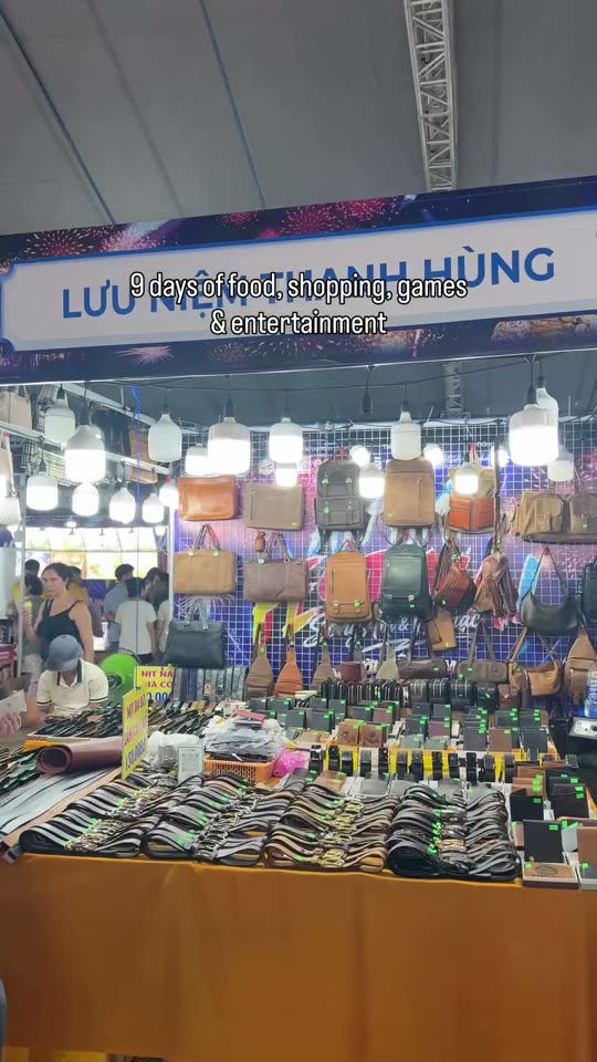 Vendor stalls strung with lights at the An Hai Festival night market in Da Nang.